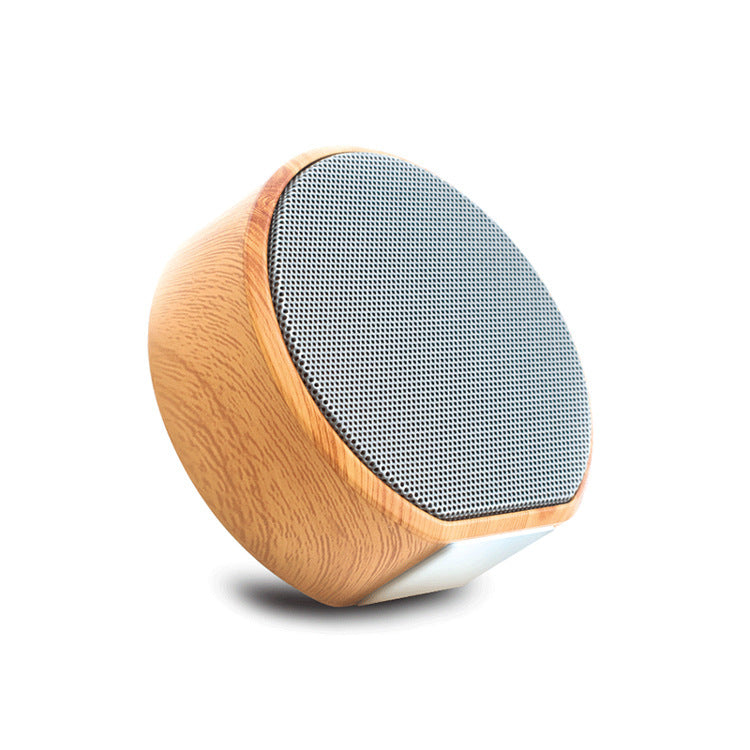 Mini Bluetooth Speaker Outdoor Portable with black mesh grille and wood finish, supports AUX and TF card for versatile playback.