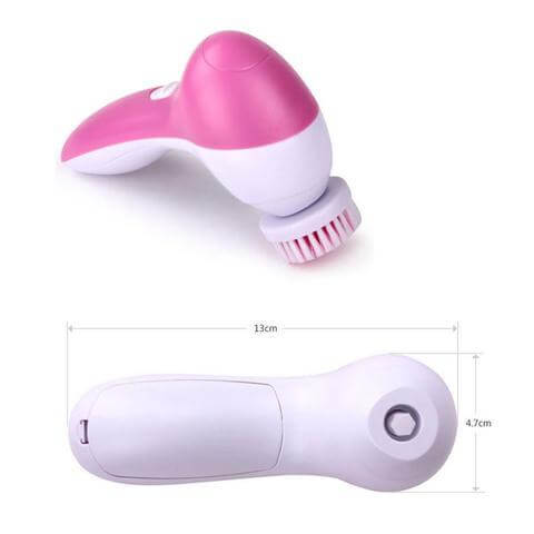 Compact pink and white electric facial cleanser with brush head and travel-ready design