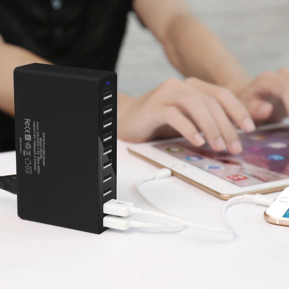 60W USB charger station powering iPhone and iPad simultaneously, featuring 10 USB ports for efficient multi-device charging at once.