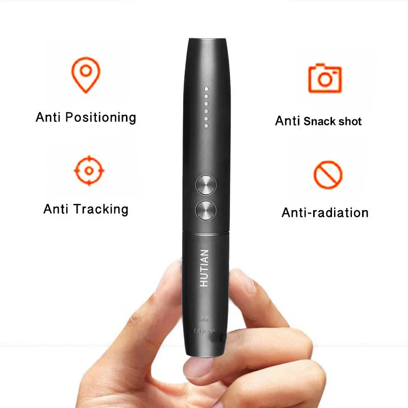 Black hidden cam pen anti spy camera and GPS tracker detector with anti-positioning, anti-tracking, anti-snack shot, and anti-radiation features held in hand