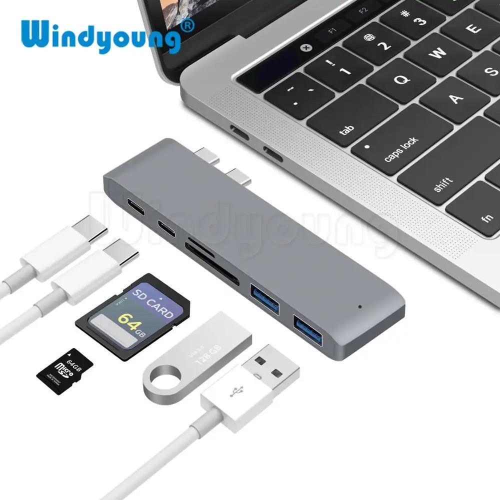USB C Hub for MacBook Pro Adapter with 6 ports including SD card reader, USB 3.0, and Thunderbolt 3 in space gray. Ideal for Apple users.