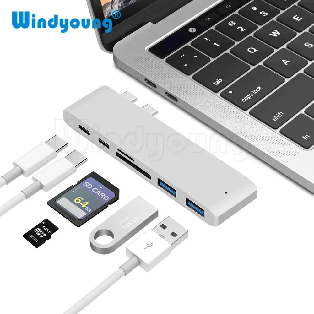 6-in-1 USB C Hub Adapter for MacBook Pro in silver, featuring SD/TF card slots, USB 3.0 ports, and dual USB-C connectors for fast data transfer.