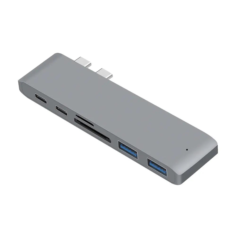 Space gray USB C Hub for MacBook Pro featuring 6-in-1 functionality with USB 3.0, SD card reader, and Thunderbolt 3 support.