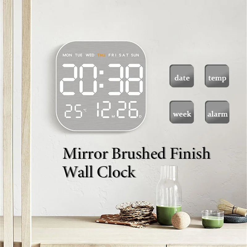 Modern digital wall clock with alarm in mirror brushed finish, displaying time, date, temperature, and weekday for home or office decor.