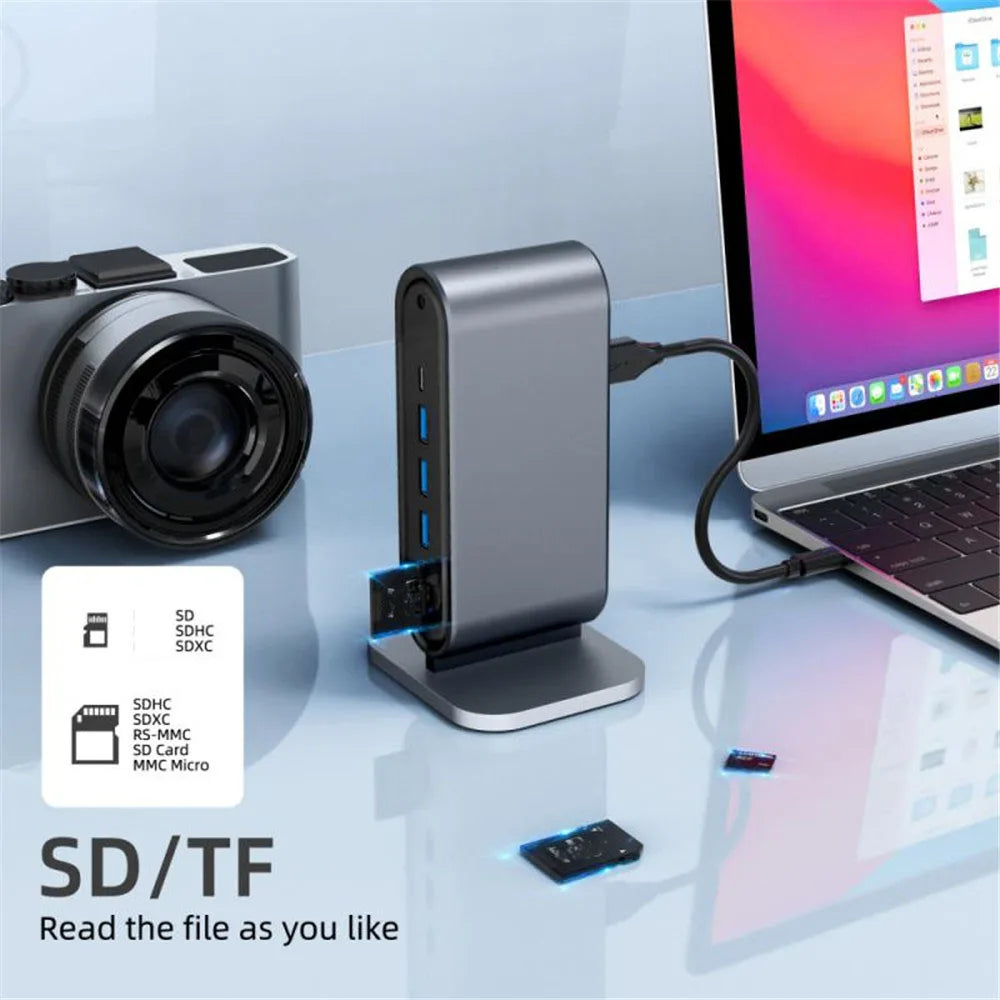 USB C Docking Station with multiple USB 3.0 ports, SD/TF card reader, and USB splitter connected to a laptop and camera