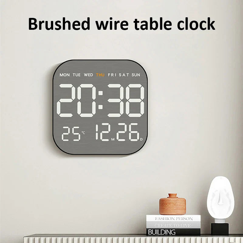 Brushed wire digital wall clock mounted above a nightstand, showing time, date, and temperature for stylish home decor.