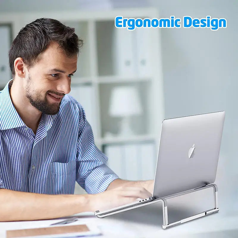 Man using aluminum alloy ergonomic laptop stand with MacBook on desk