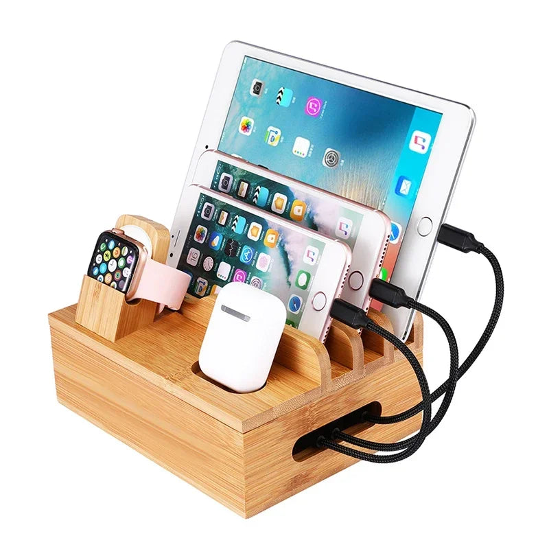 Bamboo charging station organizer holding tablet, smartphone, smartwatch, and earbuds. Compact bamboo design with cable slots for tidy charging.